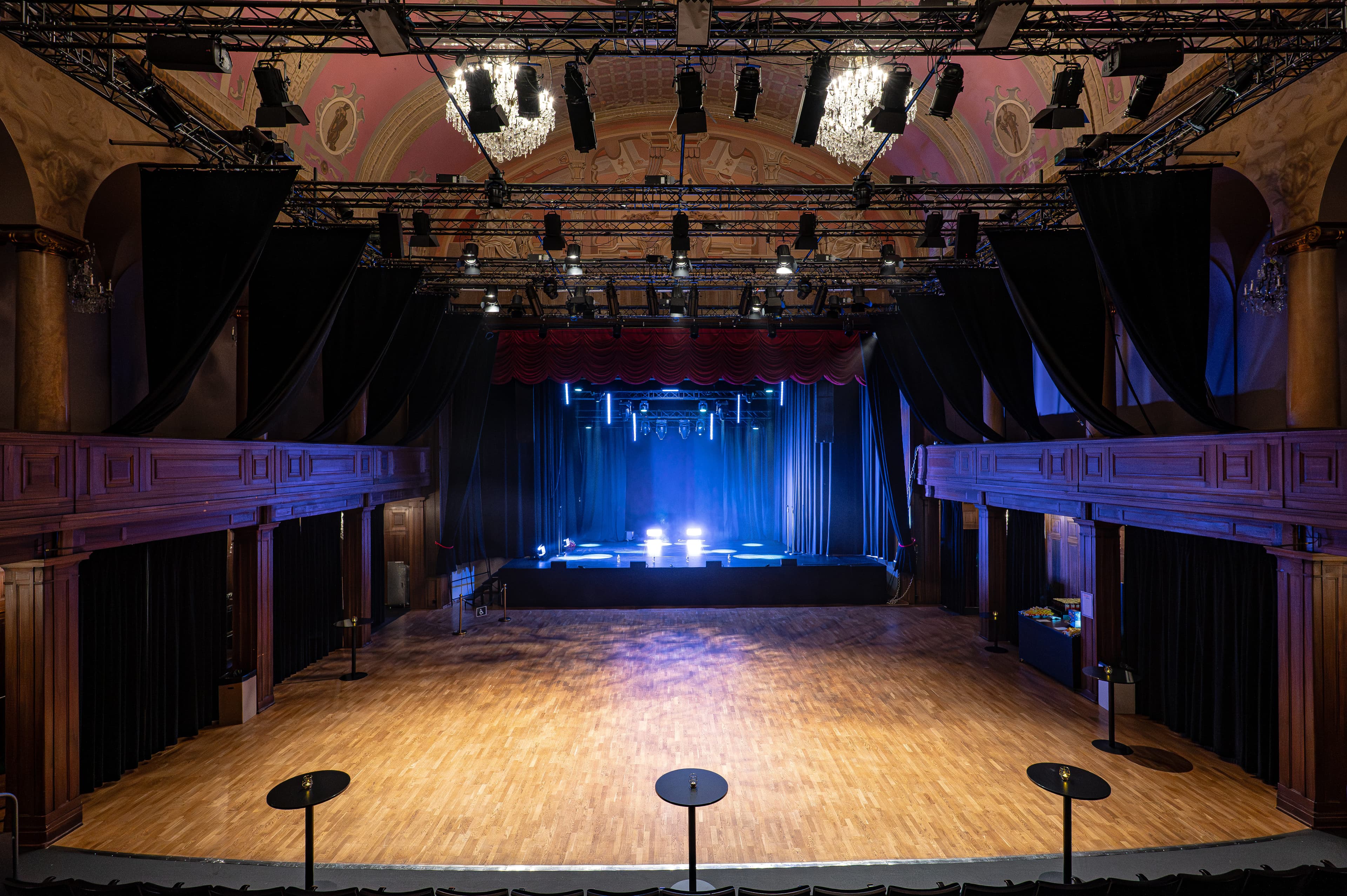 The Main Hall in standing configuration with parquet floor, balconies and crystal chandeliers